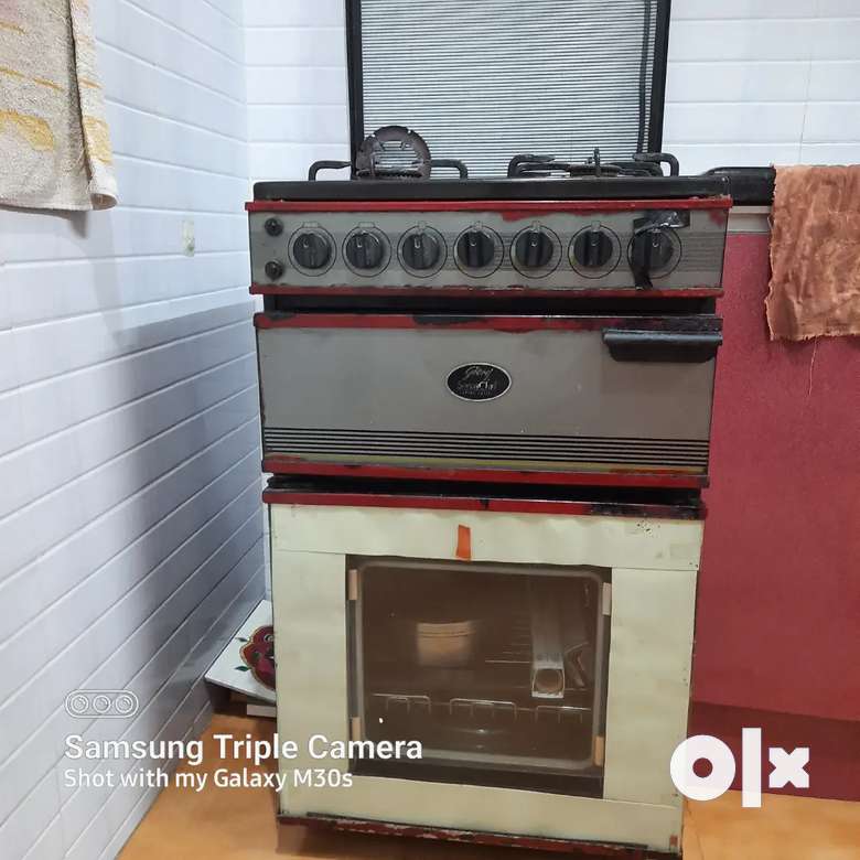 Godrej Chef Cooking range with 3 burners , Hot plate, grill, oven